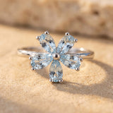 Bague “Fleur de Lumière” en Topaze Bleue