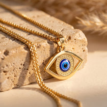 Pendentif Oeil Bleu - Protection Symbolique du Mauvais Oeil - Dorée - L'Arbre des Chakras