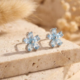 Boucles d’oreilles "Fleur de Sérénité" en Topaze Bleue