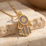 Pendentif "Lumière & Protection" Hamsa Dorée